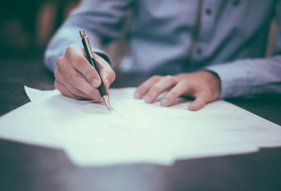 A person reviewing paperwork