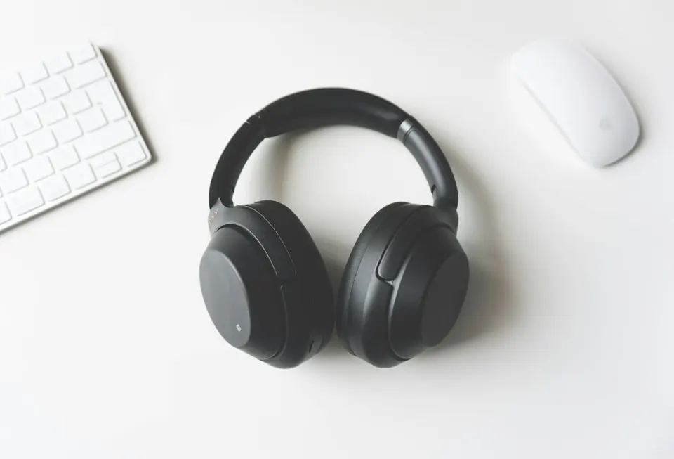 Black over-ear headphones on a light background